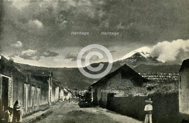 'Typical Side Street in Mexican Village: The Town of Ameca and Cloud-Effect on Popocatepetl', 1919. Creator: Unknown.