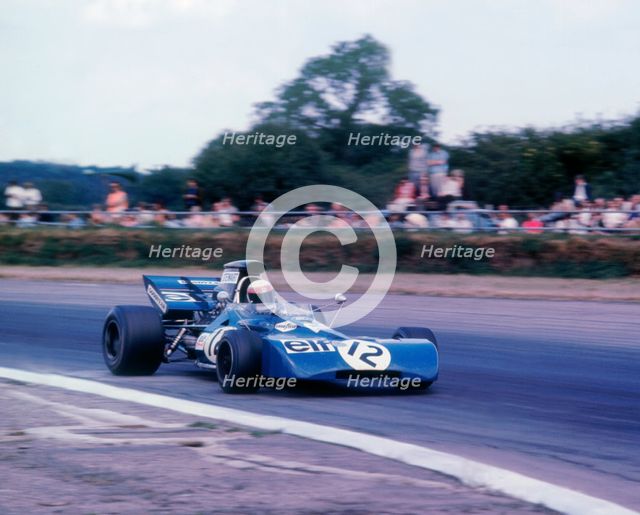 Tyrrell 003 driven by Jackie Stewart in 1971 British GP. Artist: Unknown.