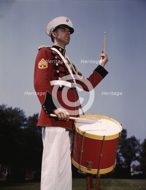 U.S. Marine Band drummer, probably at the Marine Barracks, Washington, D.C. , 1942. Creator: Alfred T Palmer.