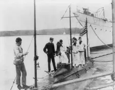 U.S. Naval Academy, Annapolis, Md. 1902?: going aboard the training submarine, (1902?). Creator: Frances Benjamin Johnston