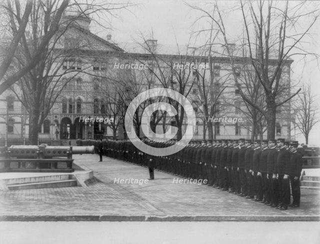 U.S. Naval Academy, Annapolis Md.: cadets lined up in row leading to building, (1902?). Creator: Frances Benjamin Johnston.