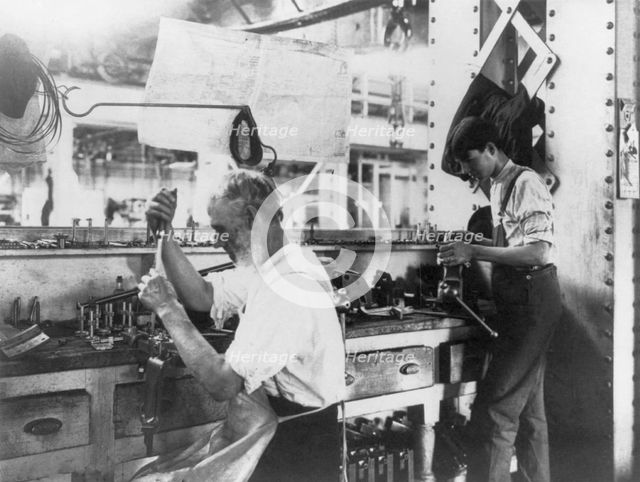 U.S. Naval Gun Factory. Wash. D.C. 2 men working at bench, 1903. Creator: Frances Benjamin Johnston.