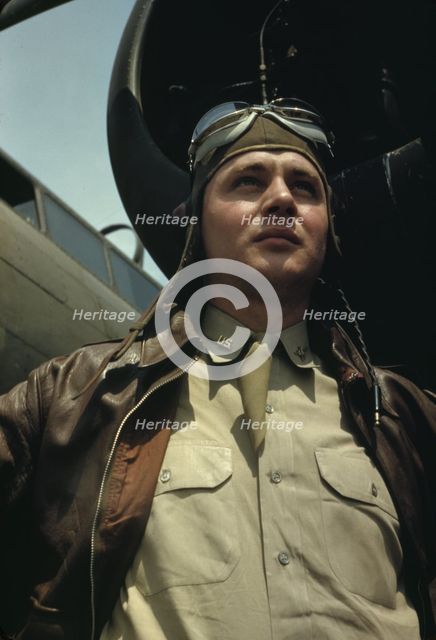 U.S. Army Air Forces pilot in front of a YB-17 bombing..., probably Langley field, Virginia, 1942. Creator: Alfred T Palmer.