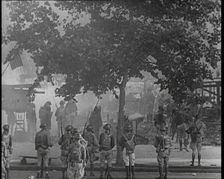 U.S Army Soldiers Confronting Protesting Soldiers With Tear Gas and Bayonets To Disperse..., 1932. Creator: British Pathe Ltd