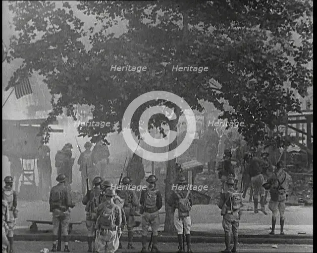 U.S Army Soldiers Confronting Protesting Soldiers With Tear Gas and Bayonets To Disperse..., 1932. Creator: British Pathe Ltd.