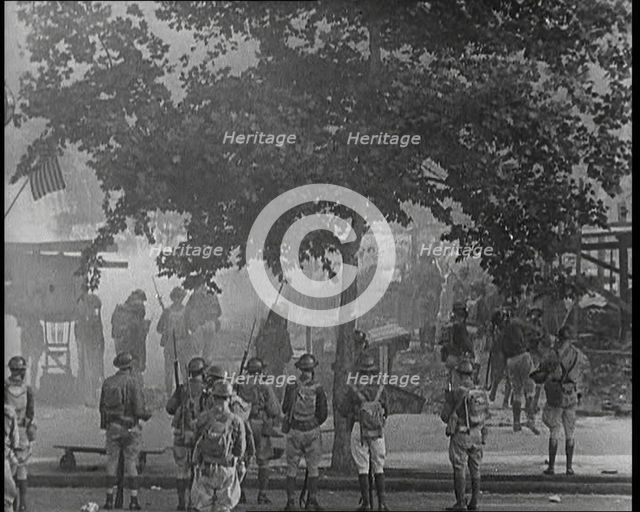 U.S Army Soldiers Confronting Protesting Soldiers With Tear Gas and Bayonets To Disperse..., 1932. Creator: British Pathe Ltd.