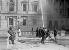 U.S. Capitol - Cleaning Exterior, 1913. Creator: Harris & Ewing