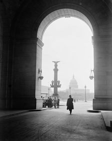 U.S. Capitol - View Through Arch At Union Station, 1917. Creator: Harris & Ewing