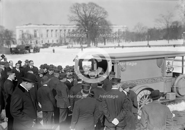 U.S. Capitol - Visitors, Etc., Casket Being Placed In Hearse, 1914. Creator: Harris & Ewing.