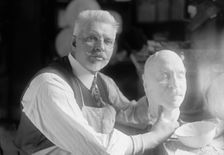 U.S.J. Dunbar with Death Mask of Admiral Dewey, 1917. Creator: Harris & Ewing