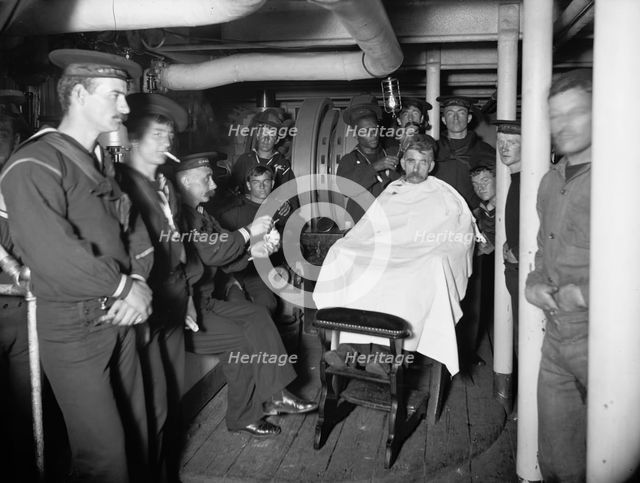 U.S.S. Brooklyn, barber shop, between 1896 and 1901. Creator: Unknown.