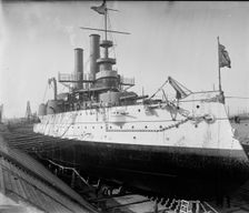 U.S.S. Iowa in dry dock, Brooklyn Navy Yard, between 1897 and 1901. Creator: Unknown