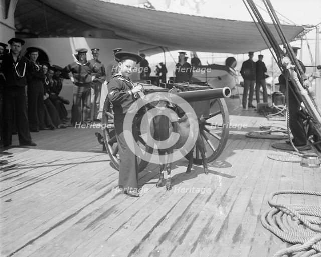 U.S.S. New York, Admiral Sampson's son and Pitch the mascot, between 1893 and 1901. Creator: William H. Jackson.
