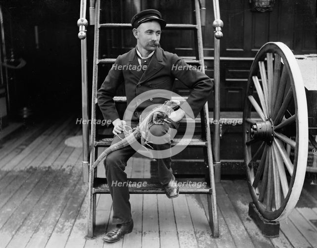U.S.S. New York, Admiral Sampson's steward and his pet, between 1893 and 1901. Creator: Edward H Hart.