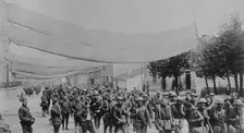 U.S. troops on camouflaged road, 11 May 1918. Creator: Bain News Service