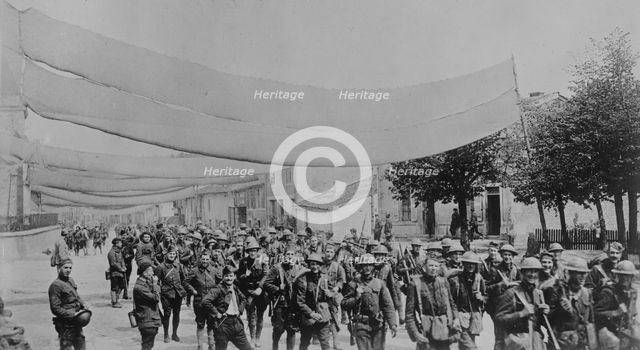 U.S. troops on camouflaged road, 11 May 1918. Creator: Bain News Service.