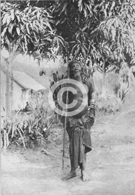 'Un sorcier au Congo francais (Il porte en main l'insigne de ses fonctions..., 1914. Creator: Unknown.