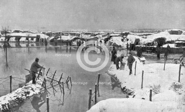 'Un secteur humide; L'inondation d'un cantonnement de deuxieme ligne en Champagne', 1917. Creator: Unknown.
