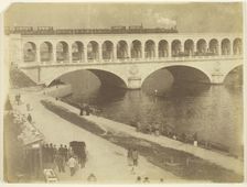 Untitled, 1870/79. [Steam locomotive on the upper level of a bridge...]. Creator: Unknown