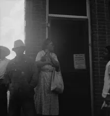 Untitled, 1935-1942. [African-Americans outside a shop]. Creator: Unknown