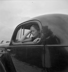 Untitled, 1935-1942. [Woman in a car]. Creator: Unknown