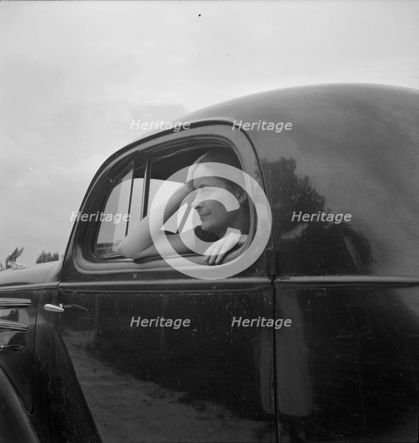 Untitled, 1935-1942. [Woman in a car]. Creator: Unknown.