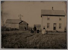 Untitled (A Man, a Woman, and Three Children Standing in Front of a Farmhouse), 1875. Creator: Unknown