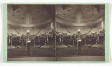 Untitled [auditorium decorated with US flags], late 19th century. Creator: Wright & Hartwell