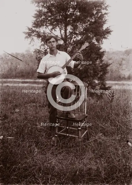 Untitled (man with banjo, neg, #1), c1931, printed c1975. Creator: Wendell Hotter.