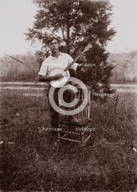 Untitled (man with banjo, neg, #1), c1931, printed c1975. Creator: Wendell Hotter.