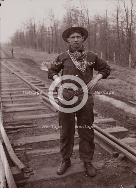 Untitled (man with pistol on railroad tracks, neg. #14), between 1910 and 1935, printed c1975. Creator: Wendell Hotter.