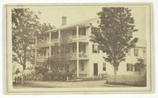 Untitled [stagecoach outside three-storey building], 19th century. Creator: T. G. Richardson