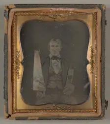 Untitled [portrait of a man holding carpentry tools], 1839/99. Creator: Unknown
