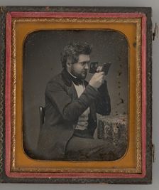 Untitled (Portrait of Man Looking Through a Stereoscope), 1856. Creator: Unknown