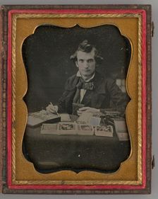 Untitled (Portrait of Seated Man Holding a Daguerreotype and Brush), 1865. Creator: Samuel J. Miller