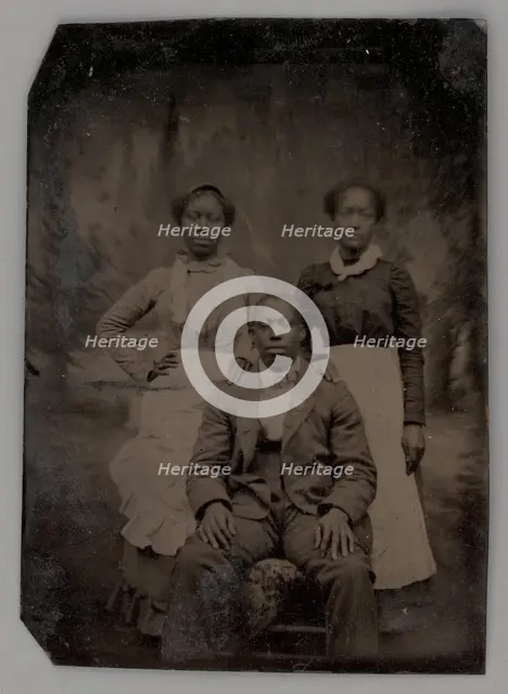 Untitled (Portrait of Two Standing Women and One Seated Man), 1880. Creator: Unknown.