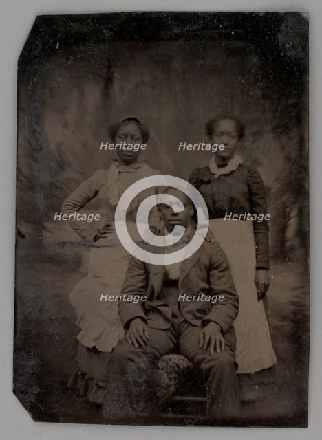 Untitled (Portrait of Two Standing Women and One Seated Man), 1880. Creator: Unknown.