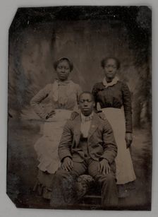 Untitled (Portrait of Two Standing Women and One Seated Man), 1880. Creator: Unknown