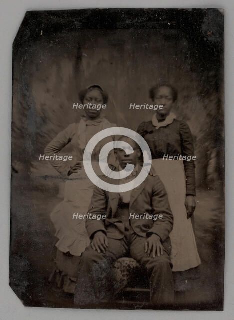 Untitled (Portrait of Two Standing Women and One Seated Man), 1880. Creator: Unknown.