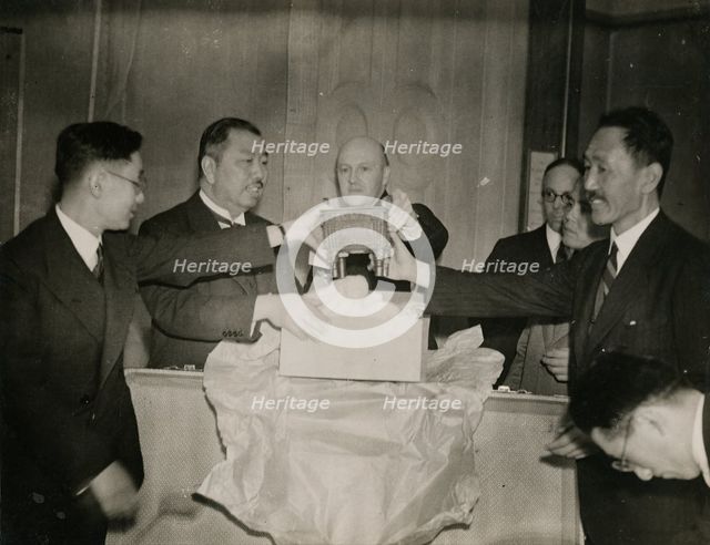 Unwrapping a bronze square Ting (cauldron), 1935.  Creator: Topical Press Agency.