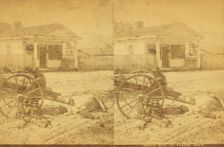 Uncle Bob at parade [rest?], [Man and children resting around an oxcart, in town], (1868-1900?). Creator: Unknown