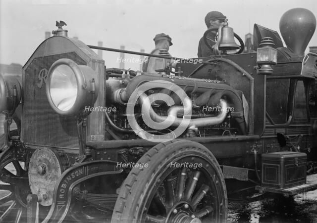 Under the hood of the motor fire engine, 1913. Creator: Bain News Service.