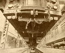 Under the Underground: Beneath a District Railway Electric Car 1930. Creator: Unknown