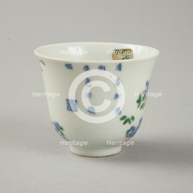 Underglaze blue month cup with polychrome enamelled decoration of a prunus tree. Artist: Unknown.