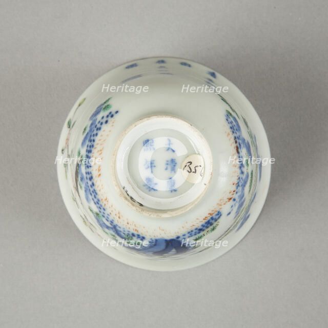 Underglaze blue month cup with polychrome enamelled decoration of a prunus tree. Artist: Unknown.