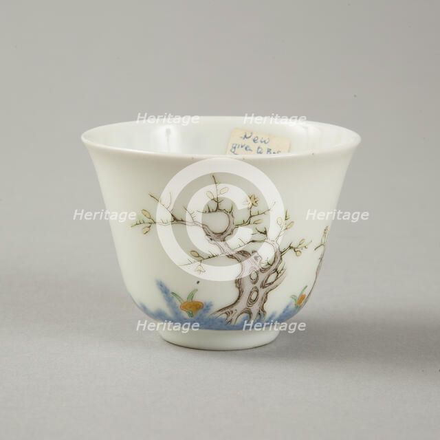 Underglaze blue month cup with polychrome enamelled decoration of a prunus tree. Artist: Unknown.