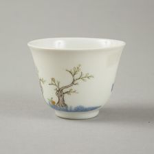 Underglaze blue month cup with polychrome enamelled decoration of a prunus tree