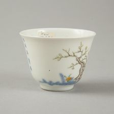 Underglaze blue month cup with polychrome enamelled decoration of a prunus tree