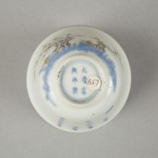 Underglaze blue month cup with polychrome enamelled decoration of a prunus tree