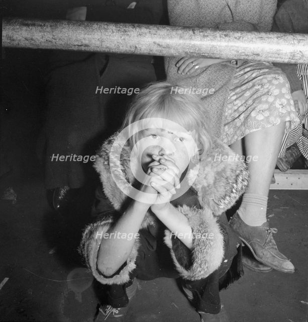 Undernourished cotton picker's child listening to speeches of organizer..., Kern County, CA, 1938. Creator: Dorothea Lange.
